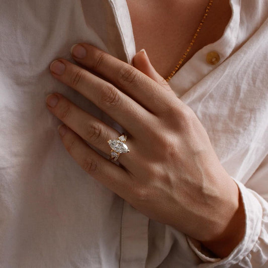 6ct Marquise With Pear Side Stone Lab Grown Diamond Ring Exquisite diamond-studded gold ring with a modern and elegant design. Luxury gold ring with sparkling diamonds, perfect for weddings or special occasions. YouTube Amazon Facebook Weather Google Gmail Wordless WhatsApp Web Translate News blog post ring ceremony Article Life Money 2025 design Ring Ceremony Diamond Shape Diamond Ring Surat Diamond India Market Diamond Ring for Her Diamond Ring for Men Diamond Ring Women Engagement Ring Finger For Her 